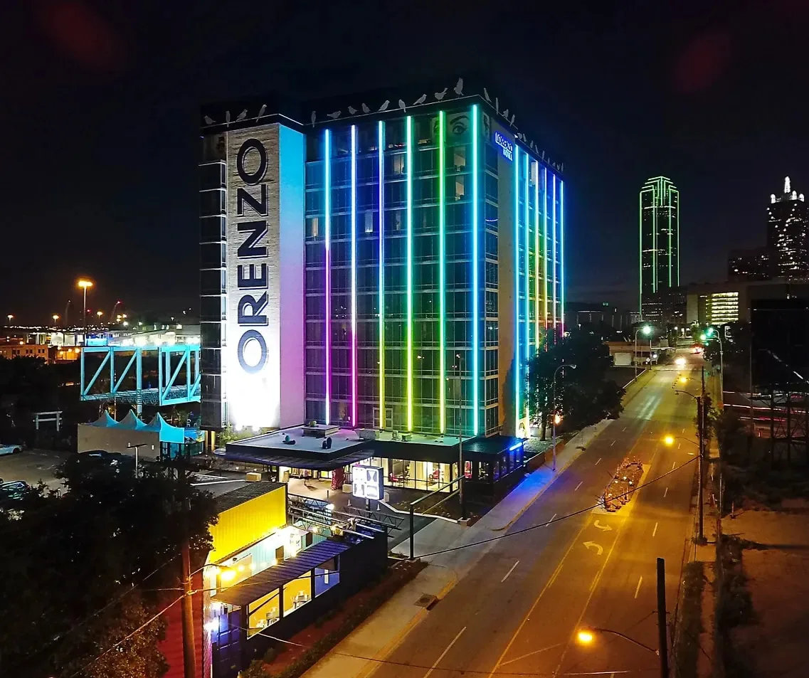 The illuminated exterior of Lorenzo Hotel Dallas at night